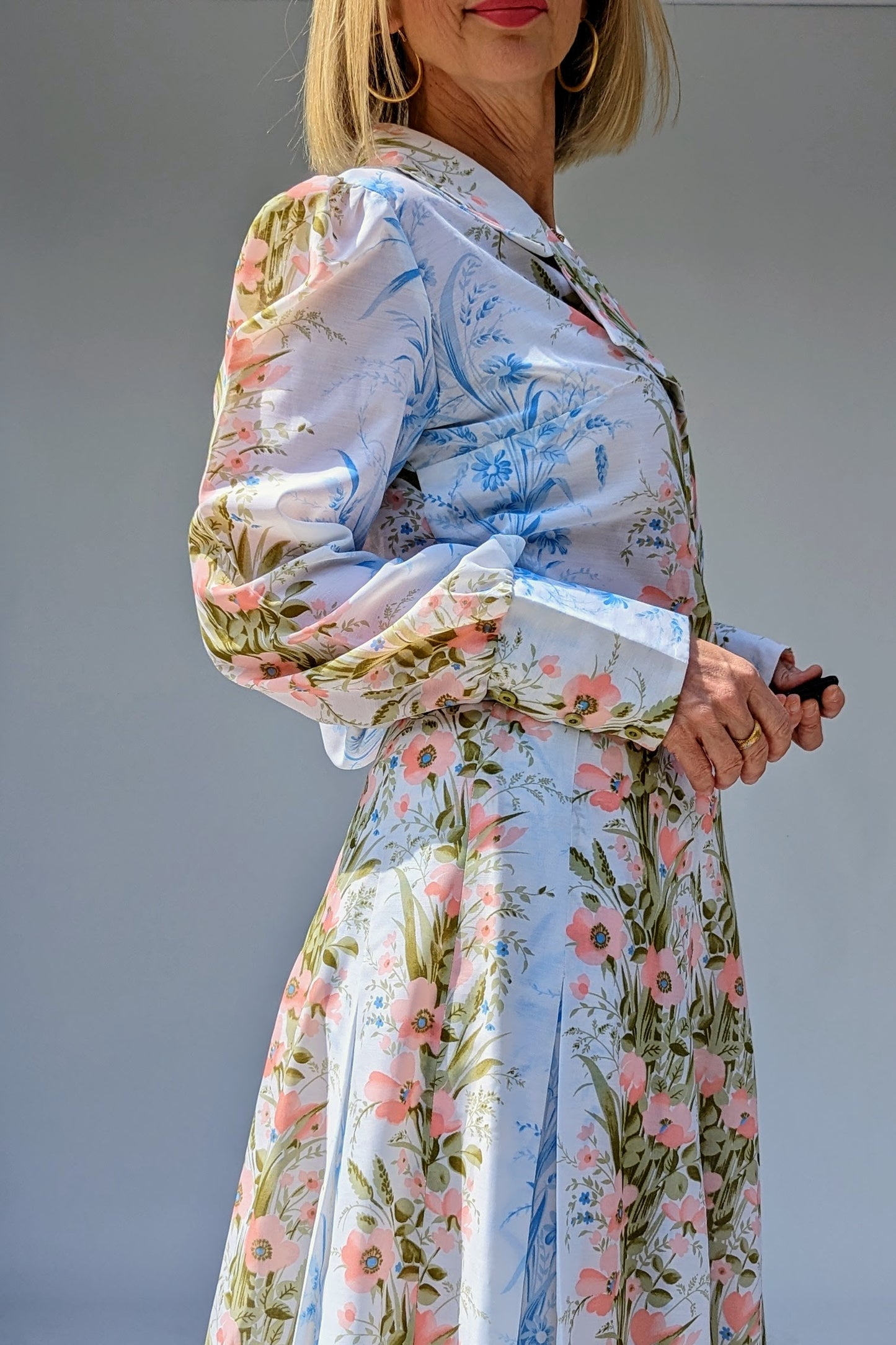 cuff on 70s vintage two piece floral skirt summer suit with long sleeve blouse and maxi skirt in pinks and blues on white
