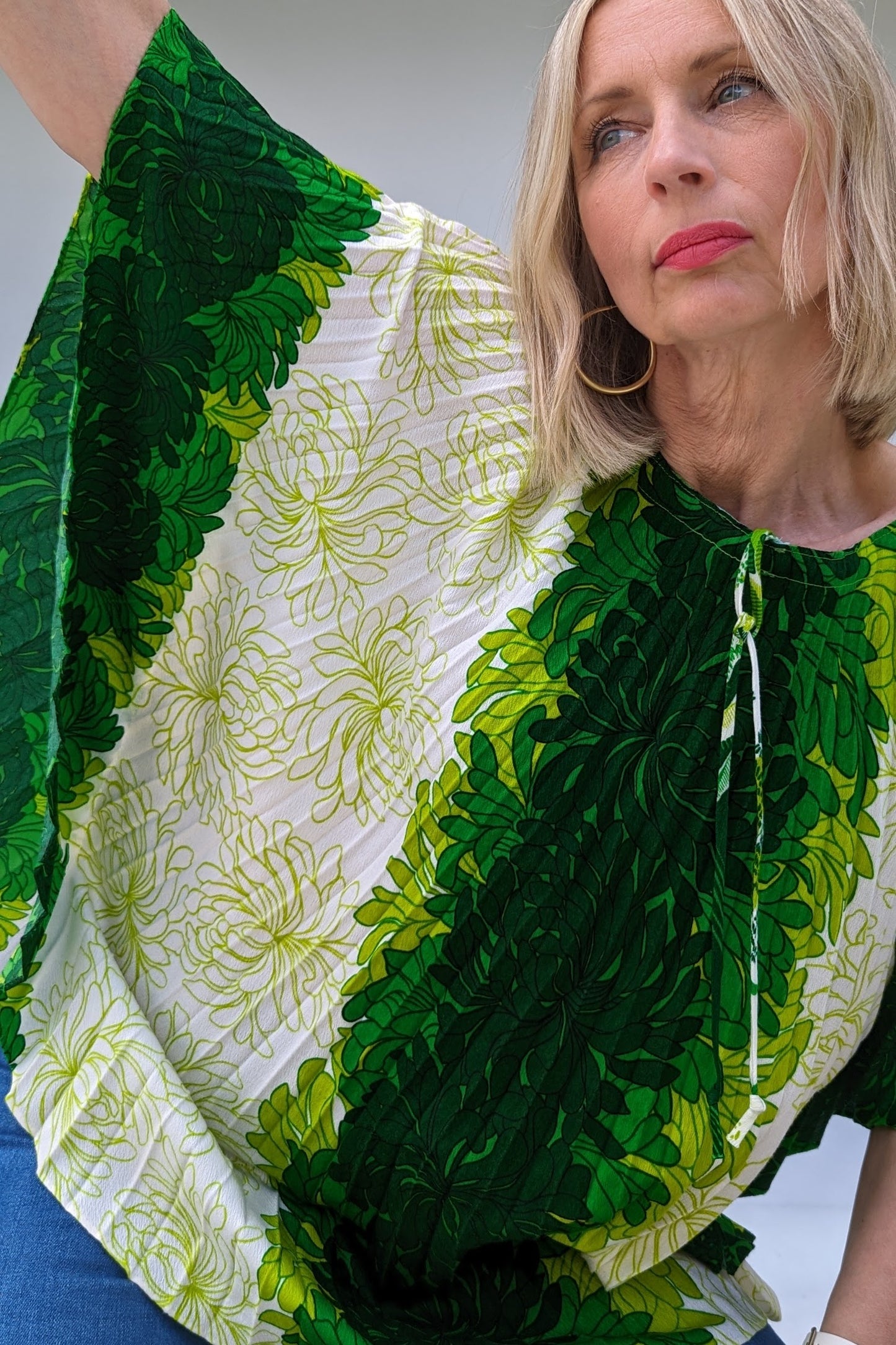 close up of front of hawaiian pleated accordian summer beach ware tropical top