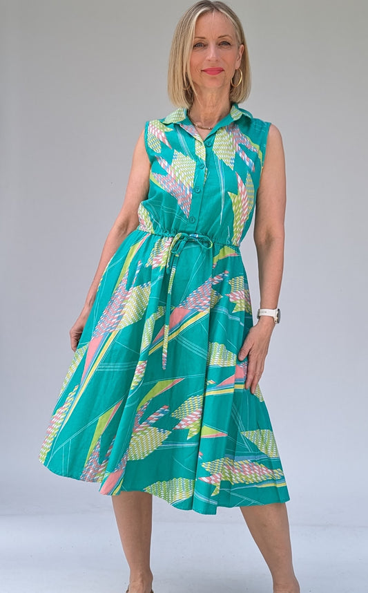 Vintage cotton summer tea dress in turquoise with a geometric pattern in pastels with tie waist