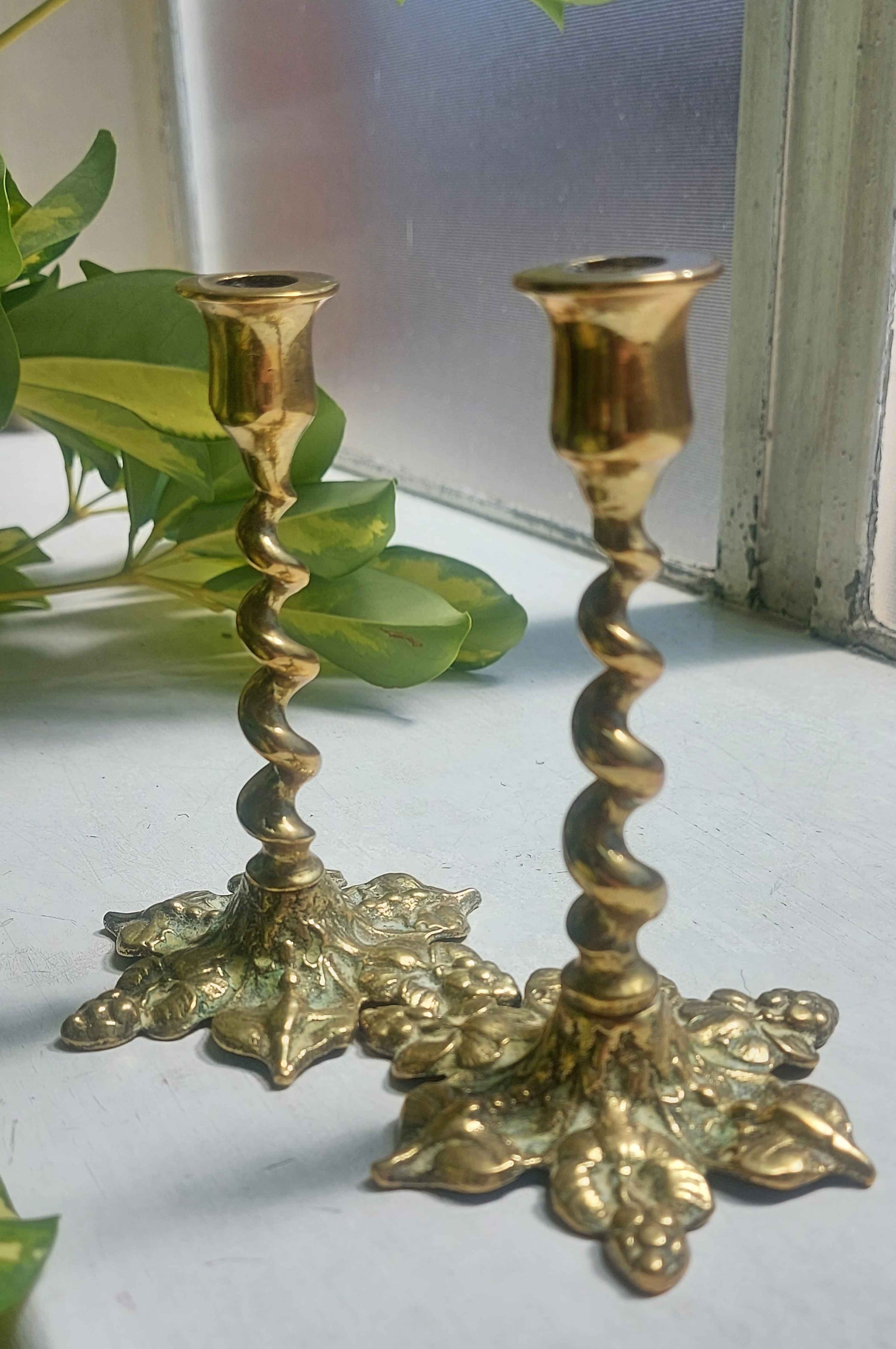 https://www.adasatticvintage.co.uk/cdn/shop/products/floral-brass-candlestick-holders.jpg?v=1657699765&width=1946